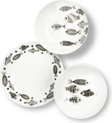 Three white ceramic plates with black fish illustrations are arranged on a white background.