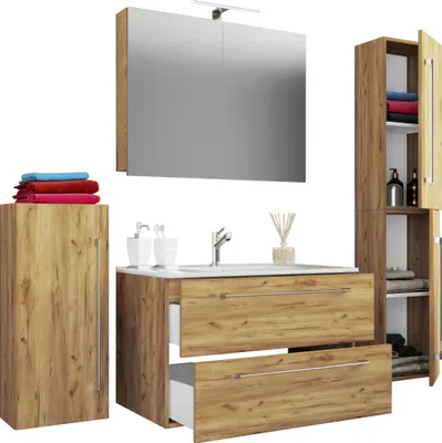 A bathroom vanity set with a sink, mirror, and cabinets.