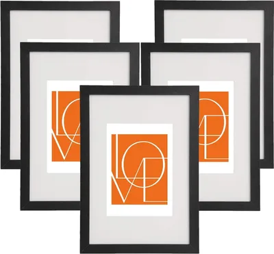 A set of five black picture frames with white mats and orange inserts featuring the word 'LOVE' in white lettering.