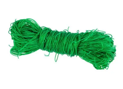 A green net is coiled and lying on a white background.