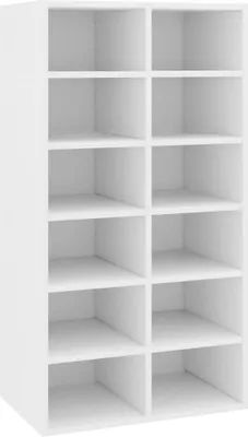 A white, multi-compartment shelving unit.