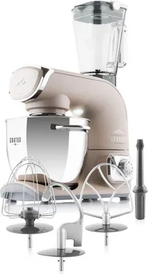 A kitchen mixer with various attachments and a blender jug, displayed on a white background.