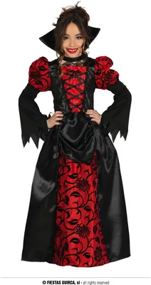 A young girl wearing a vampire costume.