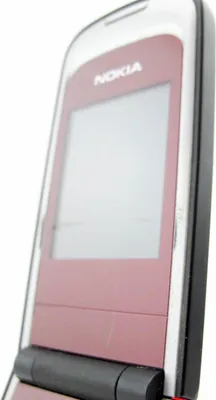 A close-up, angled view of a red and silver Nokia flip phone against a white background.