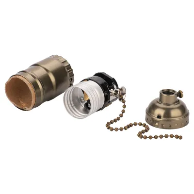 Three parts of a lamp socket assembly are laid out on a white background.
