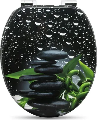 A toilet seat with a black background featuring water droplets, a stack of black stones, and green bamboo.