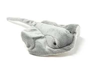 A plush toy stingray is shown from a slightly elevated side angle against a white background.