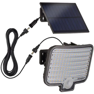 A solar-powered outdoor LED spotlight with a motion sensor and a separate solar panel, connected by a black cable.