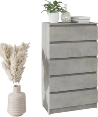 A modern gray chest of drawers next to a vase of dried flowers.
