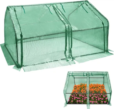 A green mini greenhouse is shown from a slightly elevated front-left angle. A second, smaller image below shows the same greenhouse filled with colorful flowers.