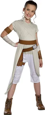 A young girl is posing in a Star Wars Rey costume against a white background.