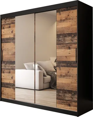 A wardrobe with sliding doors, featuring mirrored panels and wooden accents.