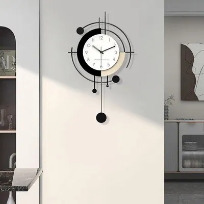 Produktbild von Minimalistische art deco muurklok met pendule, klein metaal + hout formaat