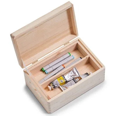 An open wooden box containing art supplies, including markers and paint tubes.