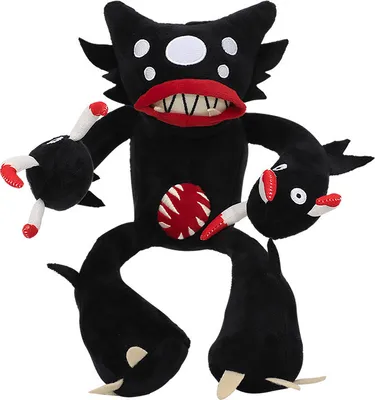 A black plush toy monster with multiple eyes, a large mouth with sharp teeth, and a red, circular design on its chest.