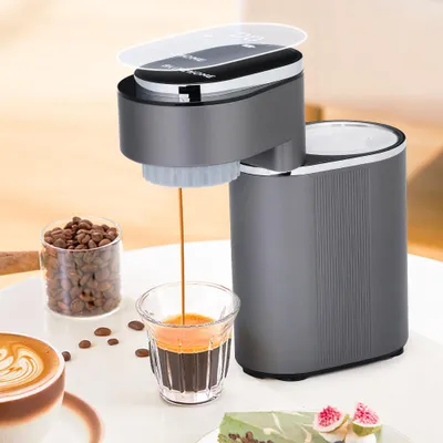 A coffee machine brewing espresso into a shot glass, with coffee beans, a latte, and cake in the background.