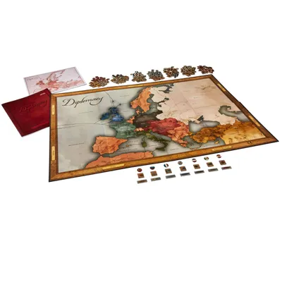 A board game map of Europe with game pieces and rulebooks.