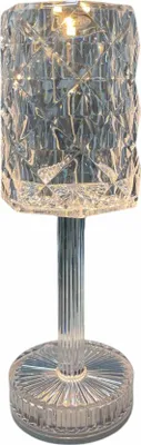 A clear, professional studio shot of a crystal-like table lamp.