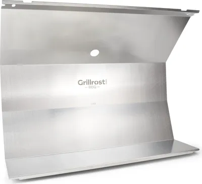 A silver metal heat shield for a grill.
