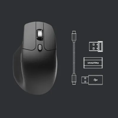 A black wireless mouse and its accessories are displayed against a dark gray background.