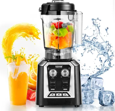 A VEVOR commercial blender is shown with fruit inside the pitcher, surrounded by splashes of orange juice and water, and ice cubes. A smoothie is also visible in a glass.