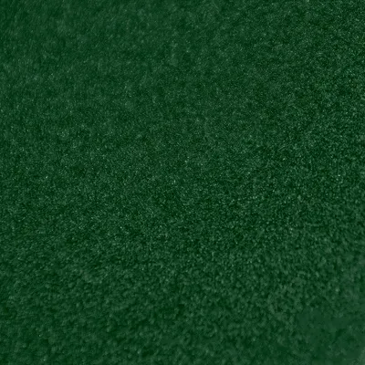 A close-up textured view of dark green velour fabric.