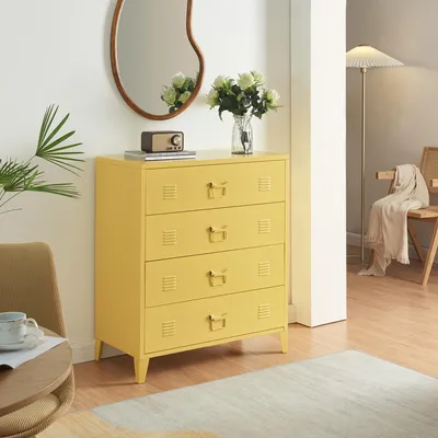 A yellow metal dresser with four drawers is shown in a room with a mirror, a plant, a chair, and a floor lamp.