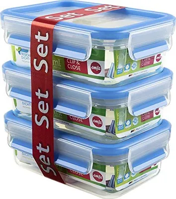 A stack of three clear glass food storage containers with blue lids, bound together by a red ribbon.