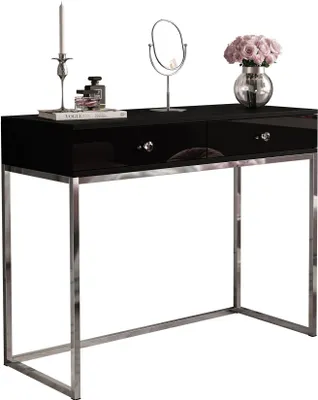 A black console table with a chrome frame, decorated with a candle, perfume bottles, a mirror, and a vase of flowers.