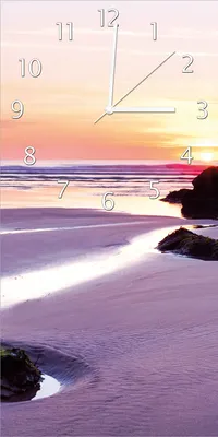 Produktbild von Wallario Design Wanduhr Sonnenuntergang am einsamen Strand aus Echtglas, Größe 30 x 60 cm