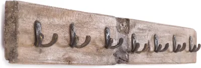 A wooden coat rack with multiple hooks against a white background.