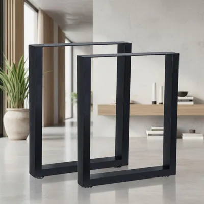 Two black metal table legs are shown in a modern interior setting.