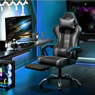 A gaming setup with a computer chair, desk, monitor, and computer tower in a room with blue lighting.