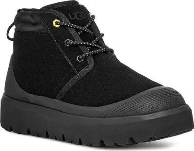 A black UGG boot is shown against a white background.