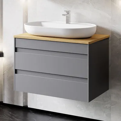 A modern bathroom vanity with a vessel sink and faucet.