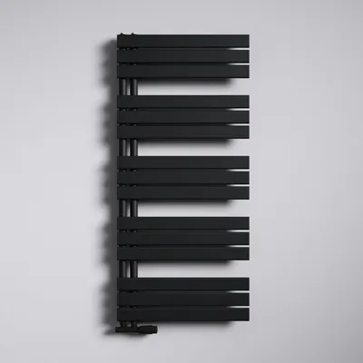 A black modern radiator mounted on a white wall.