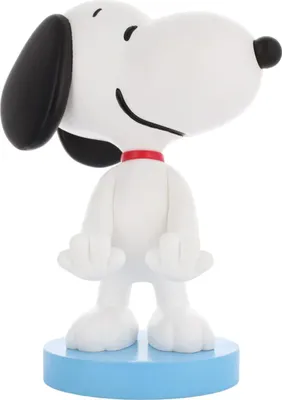 A figurine of Snoopy standing on a blue base.