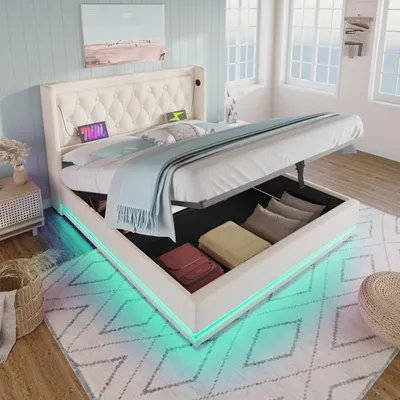 A bedroom scene featuring a white upholstered bed with storage, illuminated by LED lights.