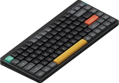 A close-up, angled view of a black mechanical keyboard with colorful accent keys against a white background.
