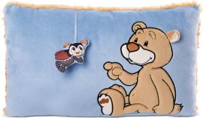 A plush pillow with a teddy bear and a ladybug applique.