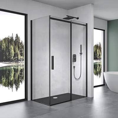 A modern bathroom with a black-framed glass shower enclosure.