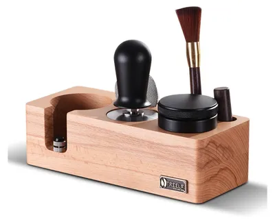 A wooden stand holding various espresso accessories.