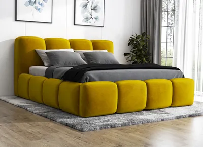 A yellow upholstered bed with gray bedding is shown in a bedroom setting.