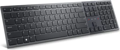 A black and gray wireless keyboard is shown from a slightly elevated diagonal angle against a white background.