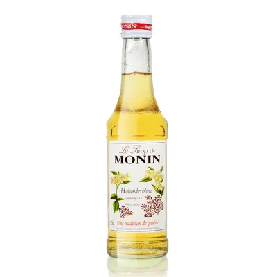 A bottle of Monin Holunder Blüte Sirup on a white background.