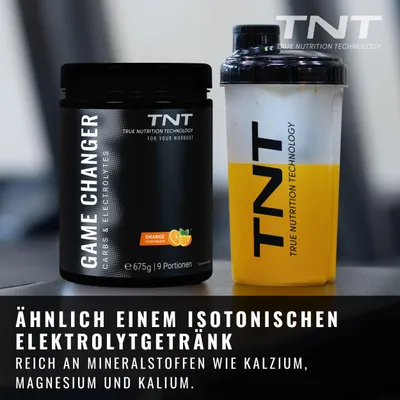 Produktbild von TNT Game Changer (675g) - Carbs & Electrolytes - Elektrolyte für dein Ausdauertraining mit Kohlenhydraten (Orangen-Geschmack)