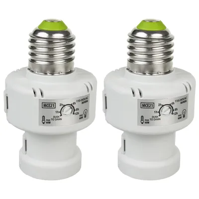 Two white light bulb adapters with silver screw bases and green tops are shown against a white background.