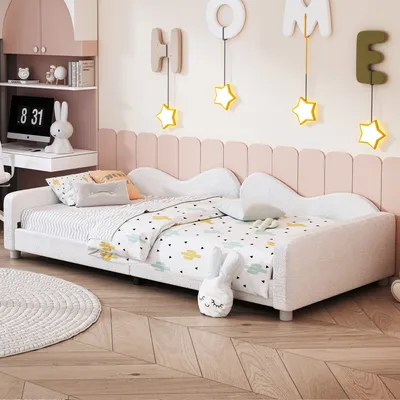 A child's bedroom with a bed, desk, and wall decorations.