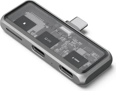 A Satechi USB-C hub with a transparent top showing internal components, isolated on a white background.