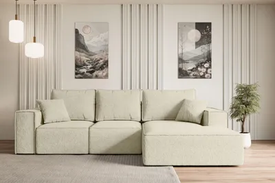 A modern living room with a beige sectional sofa, two abstract landscape paintings on the wall, and a potted plant.